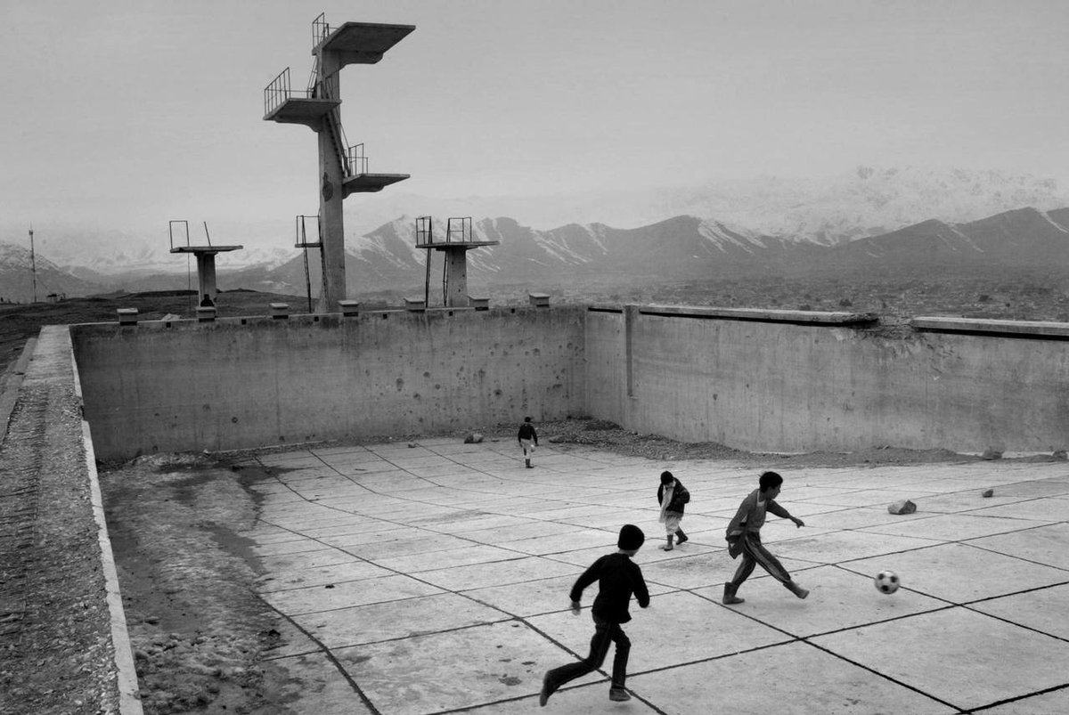 And since I have to get back to work, let's close for now with my favorite:David Guttenfelder, Boys playing football in an abandoned swimming pool, Afghanistan, 2006