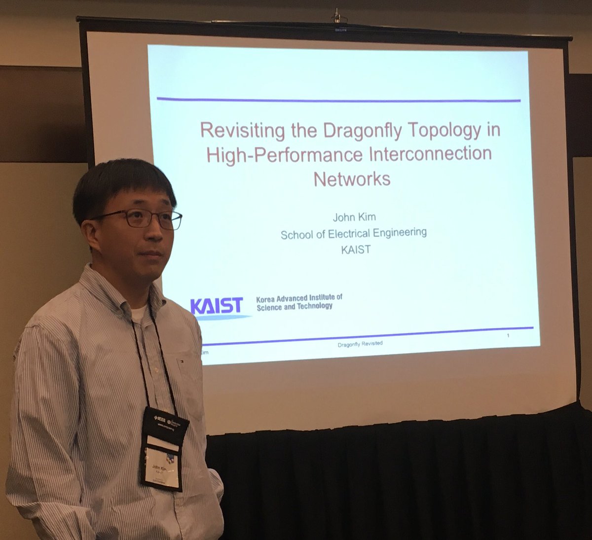 hipineb's tweet photo. Prof. John Kim, Associate Professor, KAIST (@kaistpr), South Korea presenting the second invited talk titled “Revisiting the Dragonfly Topology in High-Performance Interconnection Networks” in #Hipineb2019 https://t.co/V4Accrutme