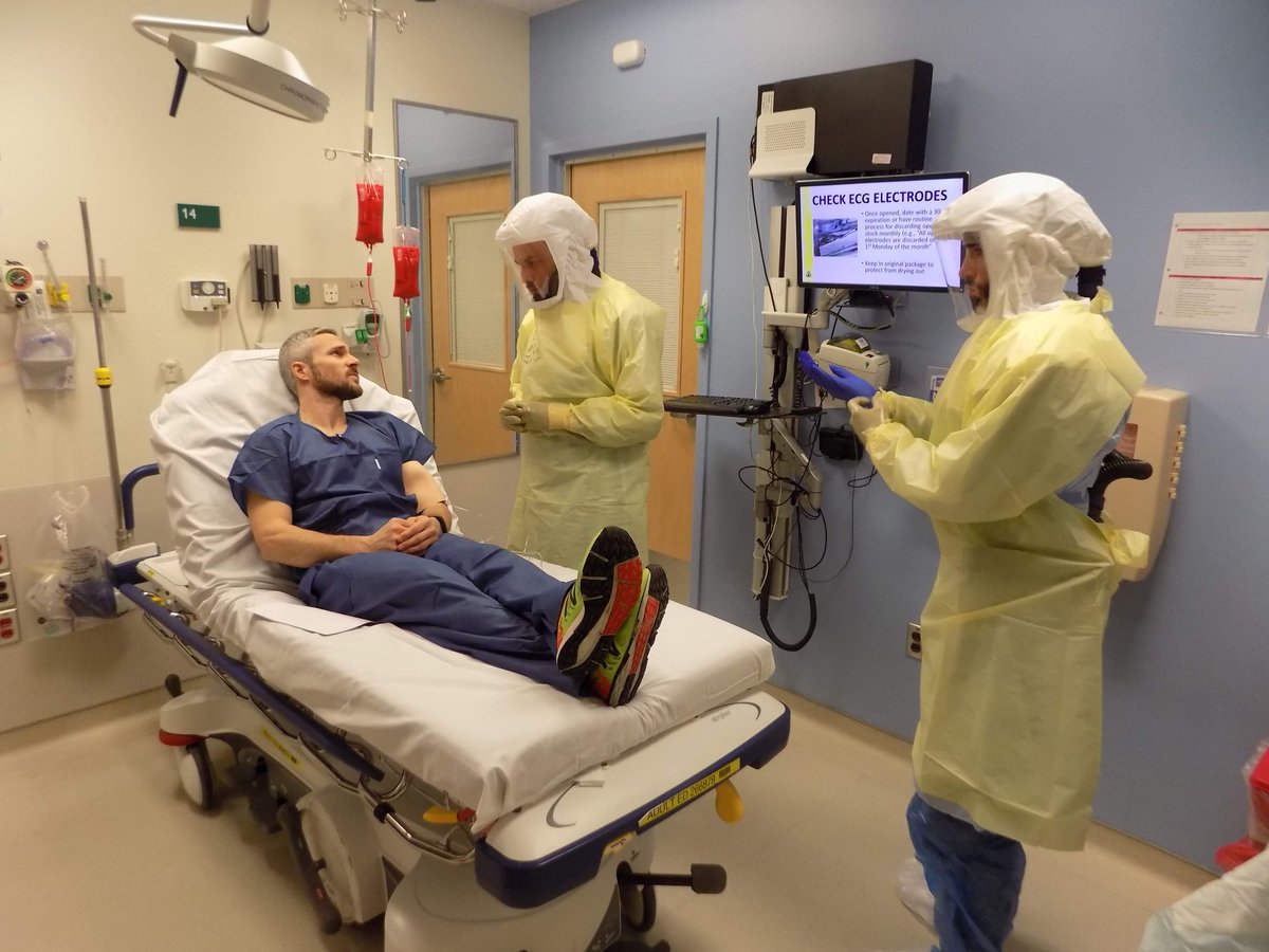 HopkinsMedicine's tweet photo. During a recent hospital preparedness exercise, physicians and staff at @HopkinsMedicine practice caring for a mock patient with suspected Ebola. @JohnsHopkinsEM. https://t.co/NE5aHz7oxx