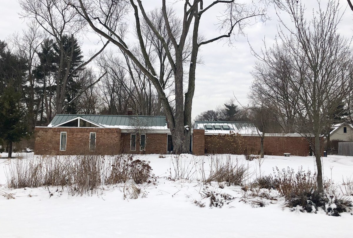 Love both of these, simple brick form contrasted with a standing seam roof 