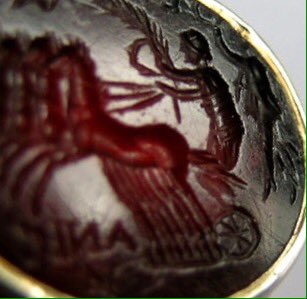 A rare 19th century mourning ring, dated 1843.

Inset with a very finely engraved Roman Carnelian Intaglio (1st-2nd Century A.D) of a Charioteer being crowned with a laurel wreath by the Goddess of Victory.

#Antiques #MourningJewellery