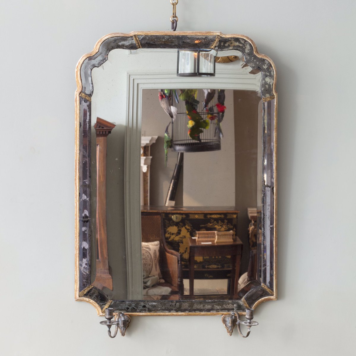 A Rare Queen Anne Marginal Wall Mirror with central re silvered, but original bevelled glass plate,above candle arm sconces. One of many rare and unique mirrors in our London showroom bit.ly/2CFxDDh