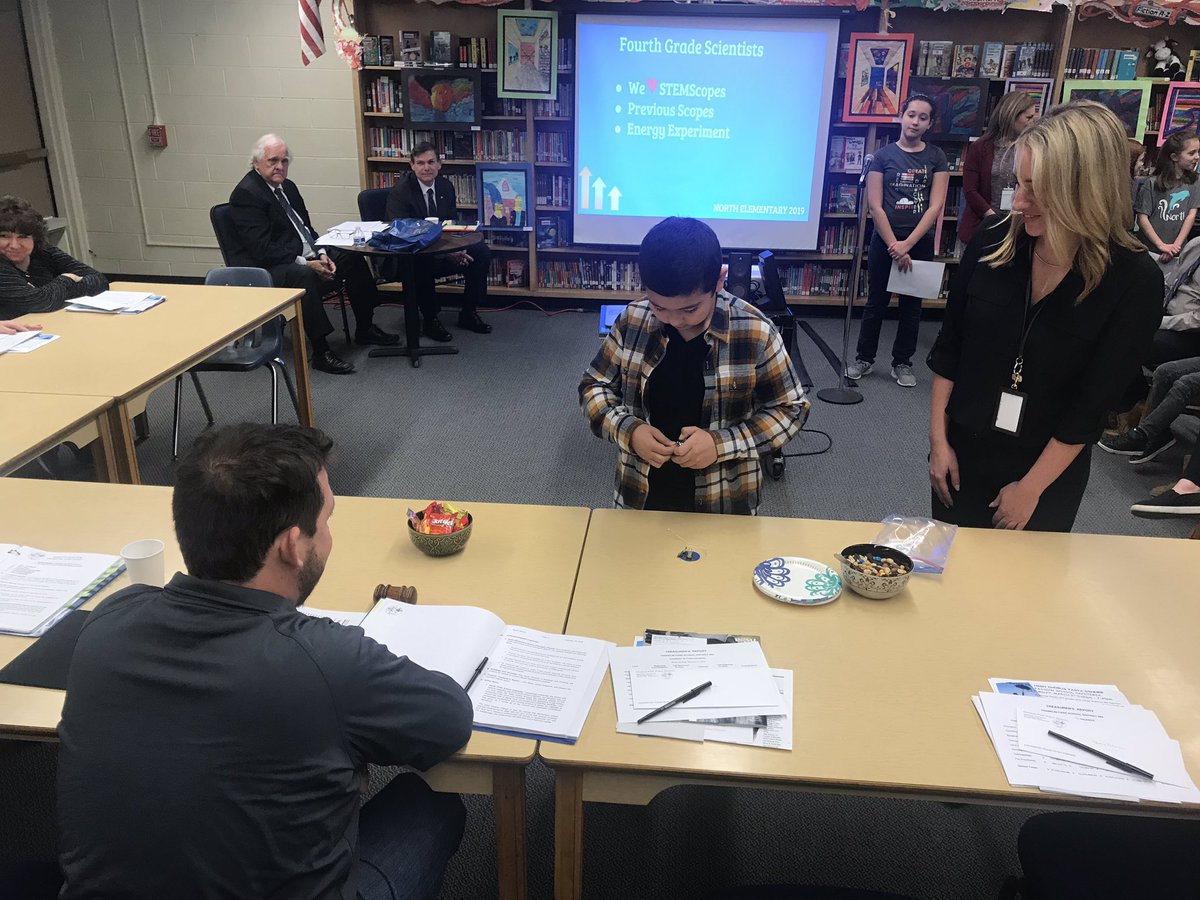 D84North's tweet image. It’s Dolphin Day at the District 84 School Board meeting!! The students are telling our board members all about the amazing things they’re working on at North!! (Currently they are teaching them about circuits👩🏽‍🔬👨🏽‍🔬) Nice work Dolphins!! #whatsacircuit #letmeshowyou #d84ontrack