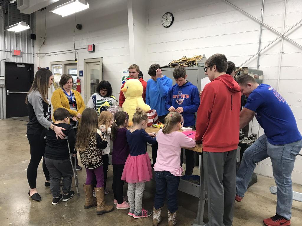 High School Ag students taught Kindergarten, 1st, and 2nd graders about hens and eggs, what eggs do for you, where milk comes from, parts of a dairy cow, milking a cow, animal terms and sounds, and Ag bingo in celebration of FFA week.