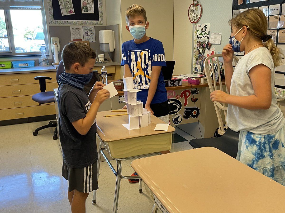 Getting to know one another with a challenge: find something we have in common, write it on an index card, and build the highest tower 📝