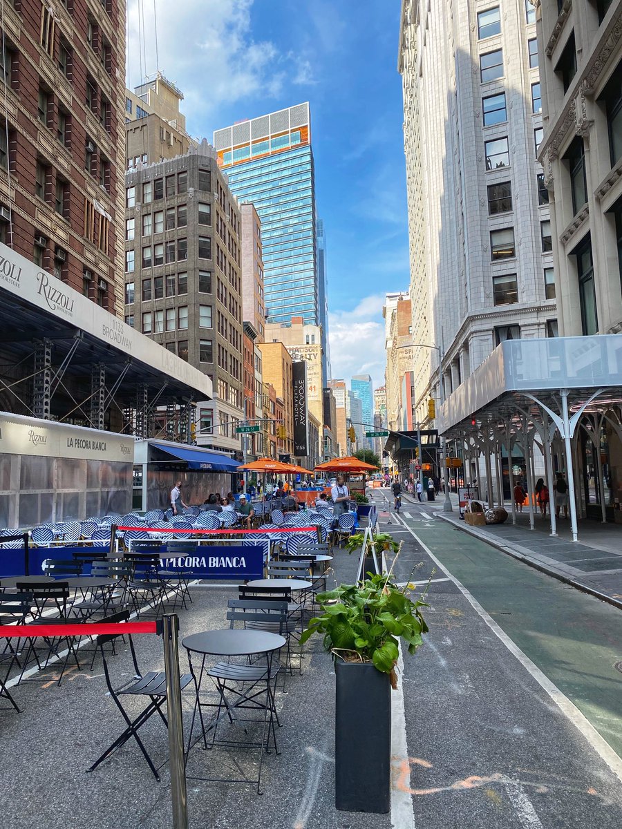 My kind of road diet: Two lanes of dining room, a buffer, and a bike lane.
