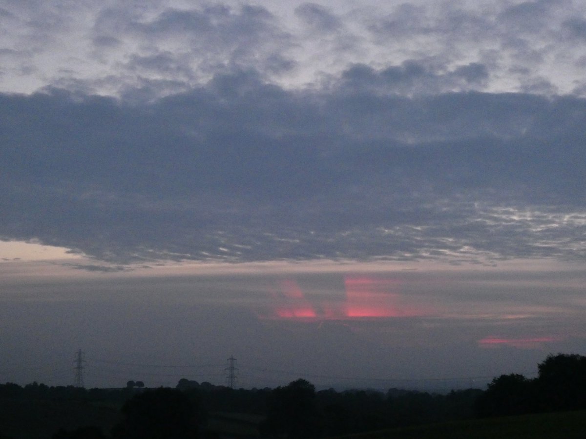 missis_teapot's tweet photo. Red crepuscular rays and shadows in Aldridge UK this morning. Not a sharp picture though. I’m guessing a tripod would have helped? #StormHour #CloudAppSoc #sunrise https://t.co/jYJnEF198y