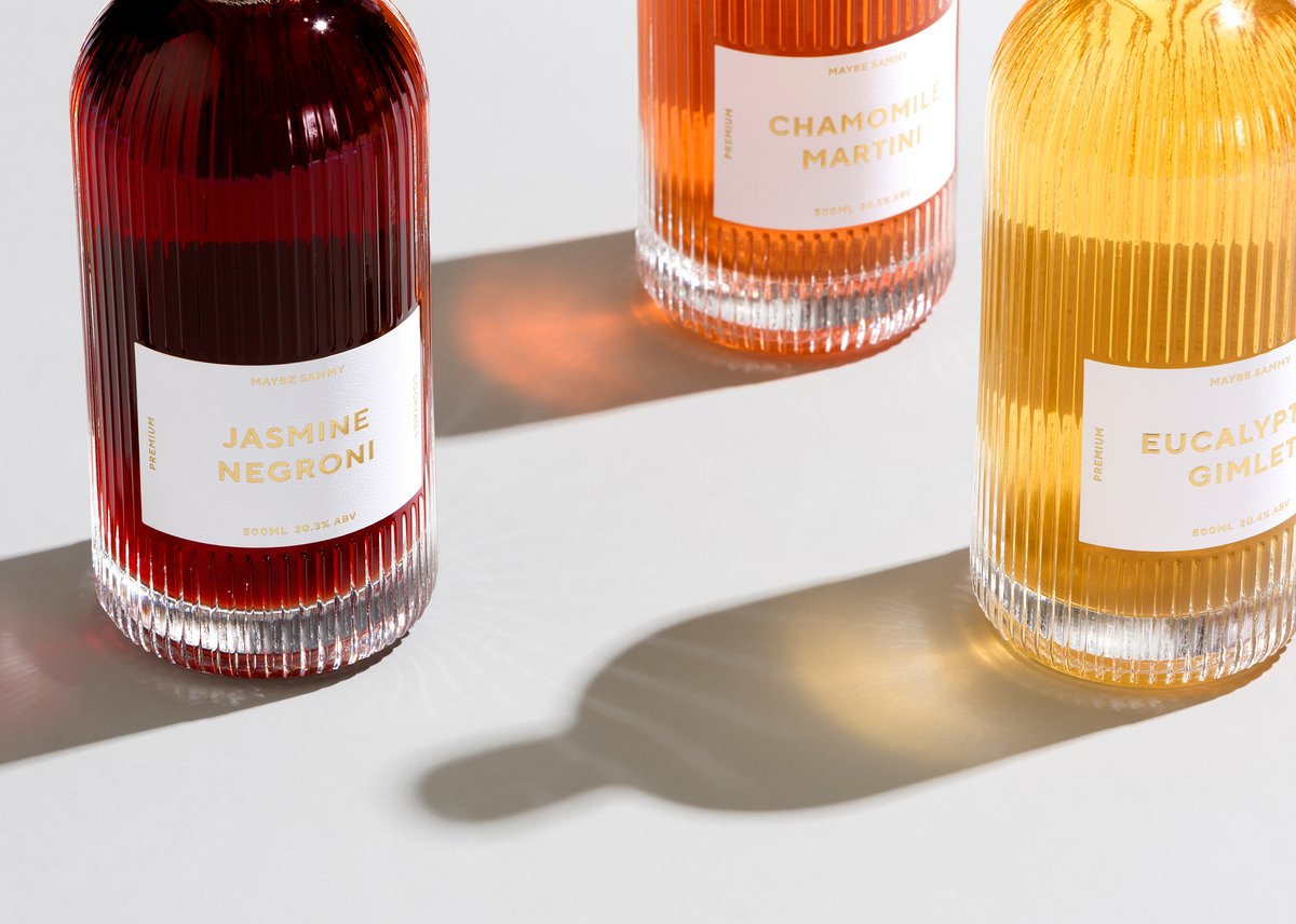 PENTAWARDS's tweet photo. The Bar Brand People design for #MaybeSammy's cocktails takes us back to the '50s, featuring labels with a minimal and refined imprint with debossed gold foil that provides a visual impact against the deep green box while communicating premium quality #DailyDesignInspiraion https://t.co/yUqCYeJc46