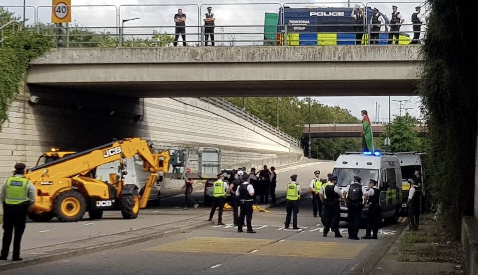 BREAKING: Activists are now occupying a police van and a @JCBmachines bulldozer, blocking the weaponry from entering the London arms fair. JCB provide the Israeli military with bulldozers used to demolish Palestinian homes. #StopDSEI #StopJCB