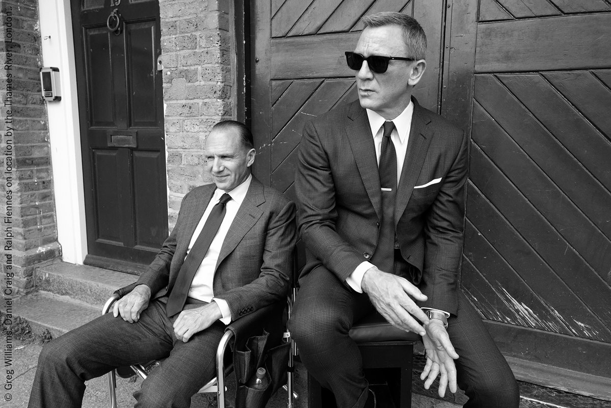 © Greg Williams: Daniel Craig and Ralph Fiennes on location by the Thames River, London.