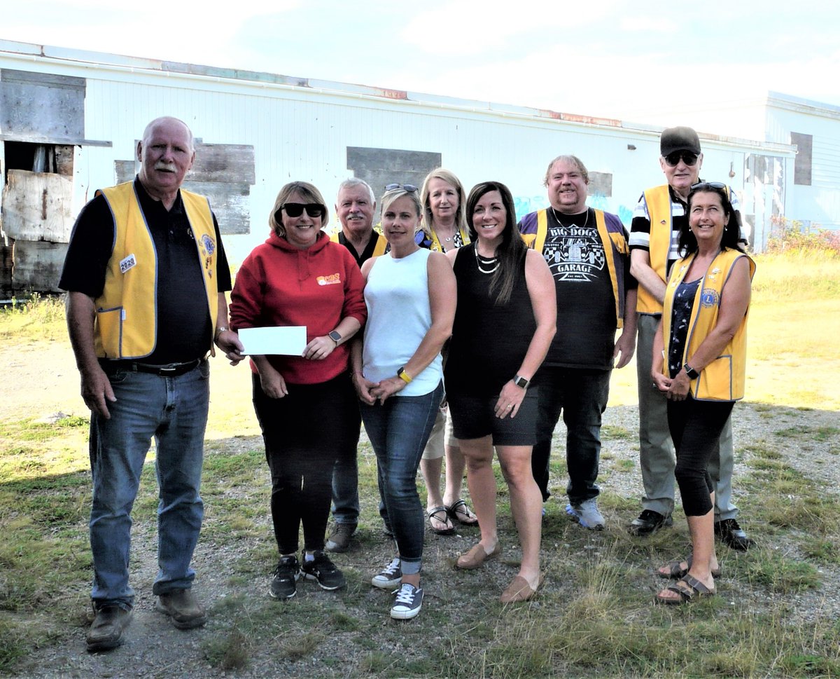 Lion Warrick Cluney, CBS Lions Club President, presents a donation to the CBS Minor Softball Association. CBS Lions have partnered with CBS Minor Softball to help realize the "Field of Dreams". 
Funds will assist with the removal of the former All Saints Primary School.