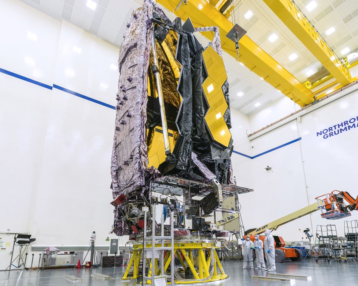 Webb is folded into its launch configuration, with its side mirrors folded back like a drop-leaf table, and its sunshield folded up around the mirror. Credit: NASA/Chris Gunn