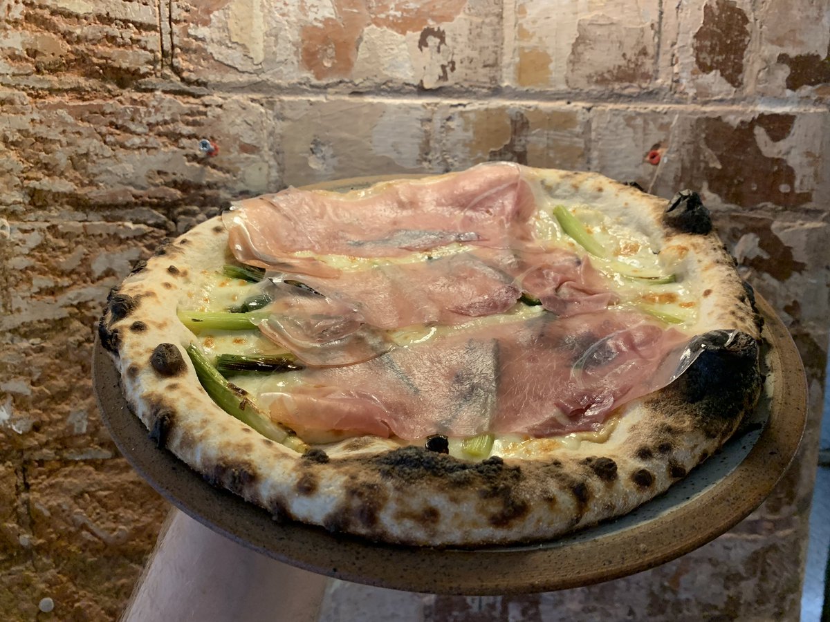 This week’s special - 
Scorched baby leeks, Scamorza, Fior di Latte Mozzarella, finished with Prosciutto di Parma (White Base) Available through all the regular channels 🍕🍕🍕
