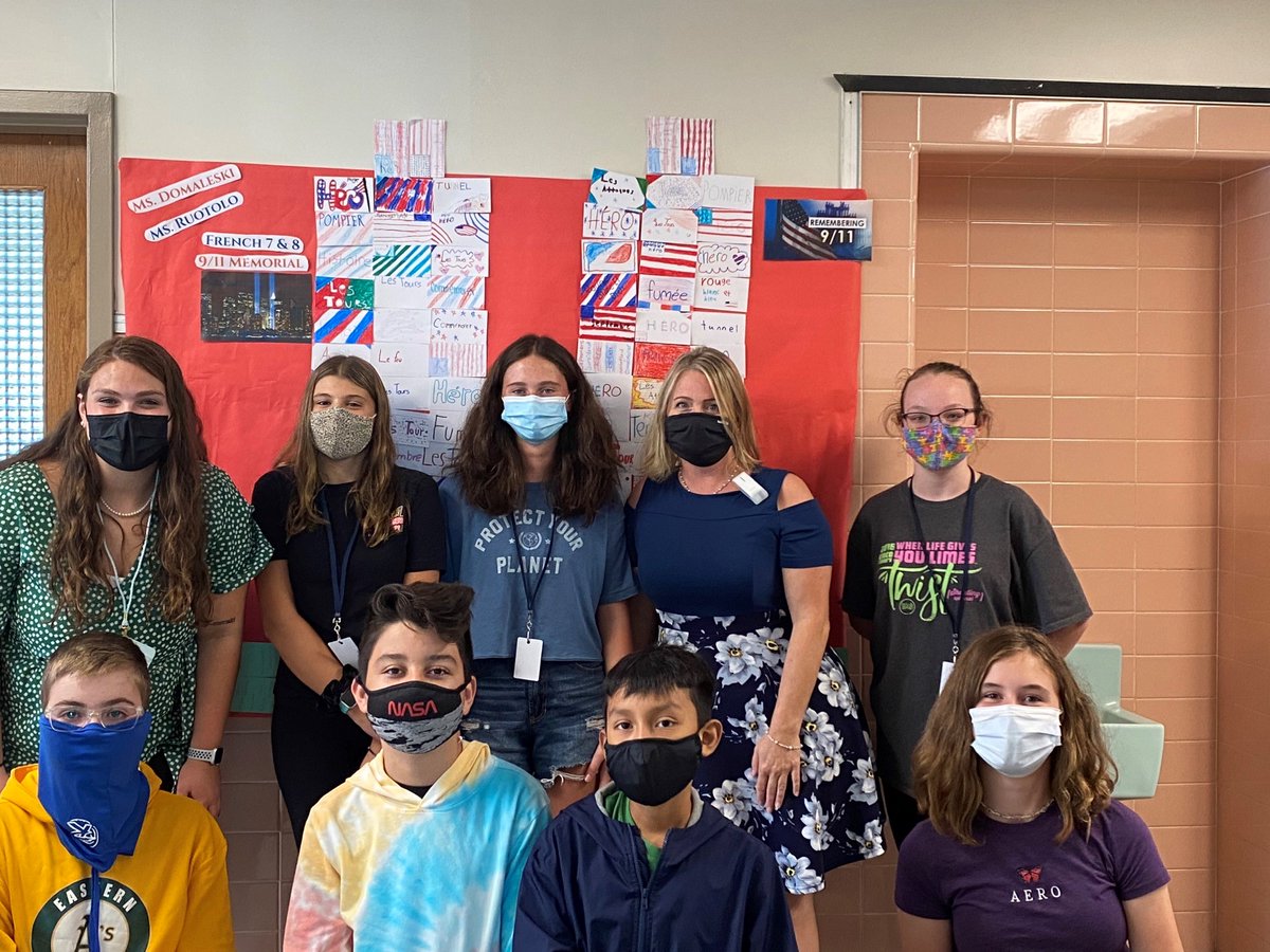 French students write a word in French related to 9/11. and decorate them in blue and red to honor the victims of 9/11.
