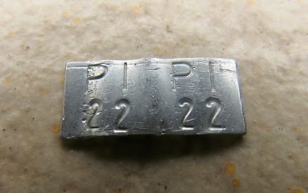 a silver band with code PI PI 22 22
