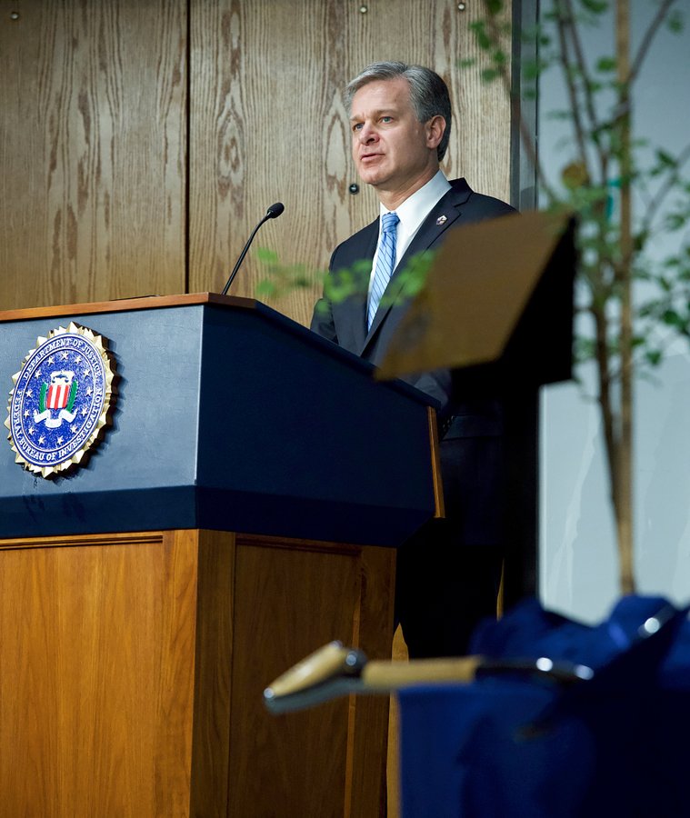 Director Christopher Wray speaks at a ceremony during which the FBI dedicated a seedling from the Survivor Tree to FBI personnel who died as a result of 9/11.