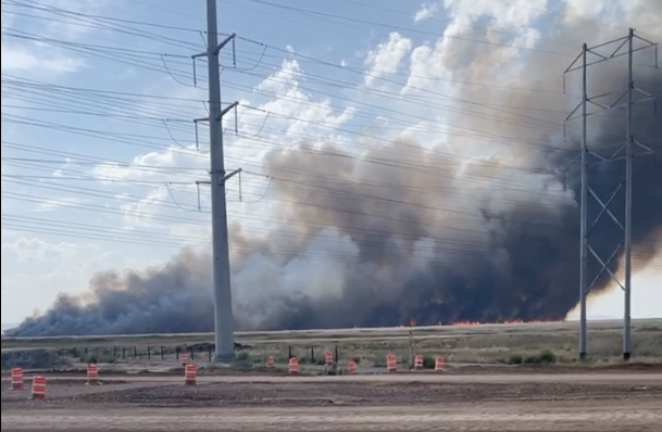 Flames visible from large blaze in marshland near Farmington Bay. Huge plume of black smoke visible from all over Davis &amp; Weber Counties. Now named the Legacy Fire.