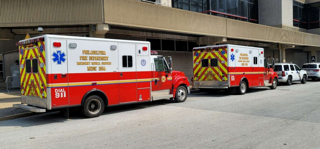 philadelphia fire department ambulances parked outside large building in daylight