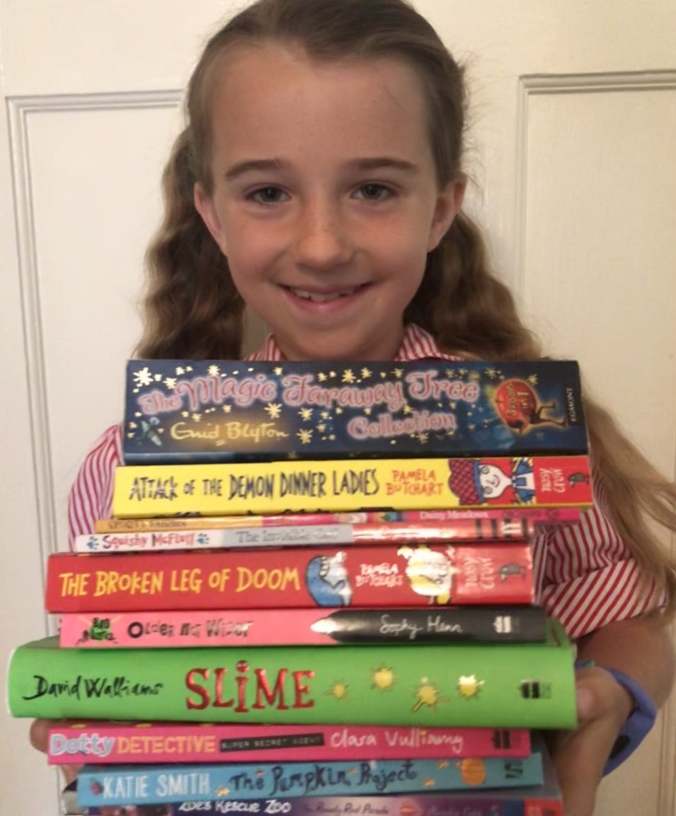 RedmaidsJuniors's tweet photo. How is the summer holiday reading going? 
Here, Tess displays the stack of books she read at school last year. 
We would love to see your summer book stacks!
#shareyourstack https://t.co/Dn4n4AMr7y