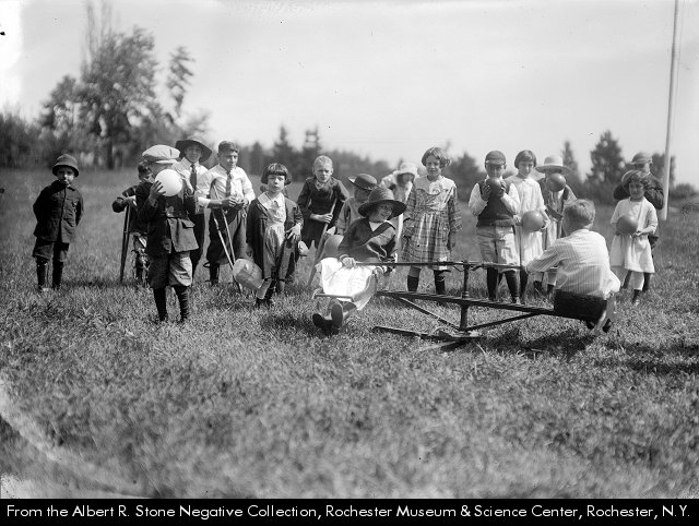 rocRMSC's tweet photo. Some types of play never change ๐ค These kids are playing with an old merry-go-round and some balls at Johnson Manor House, a summer camp for disabled children. Did you enjoy toys like this when you were this age? Reply with your favorites๐๐๐ #AlbertStoneCollection https://t.co/vnMw4pj61x