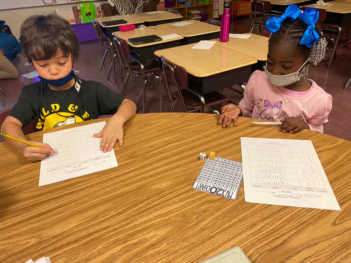 Just a little math action going on in room 205! Frameworks, number charts, and dice…oh my! @RCE_HCS #fueledbyenthusiasm