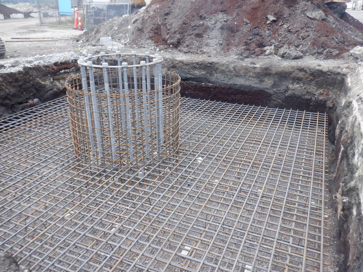 G2_Consulting's tweet photo. The magic behind installing a pad and pier foundation for a 130-foot monopole tower ✨ Excavate the mat foundation, place the steel reinforcement for the mat and center pier, pour the concrete &amp; let it cure. 

#pierfoundation #excavate #monopoletower #towerconstruction #concrete https://t.co/bOB8MbS8mY