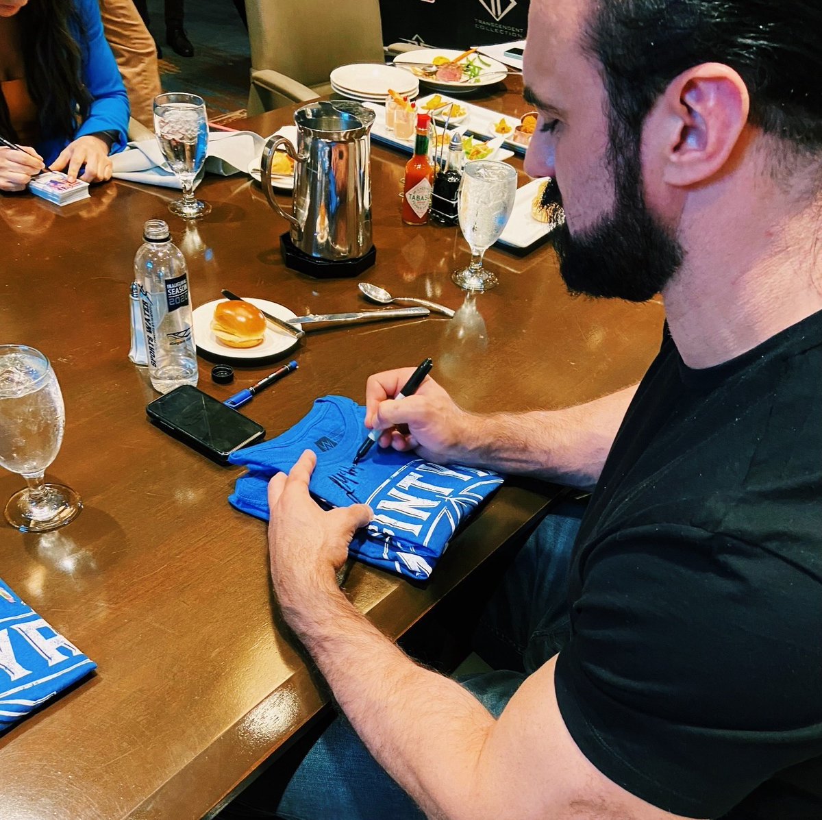 Check out @DMcIntyreWWE signing @WWE t-shirts for the winners of his #AChosenDestiny sweepstakes! Learn more about his #audiobook here: bit.ly/2V2pH9O CC:@GalleryBooks