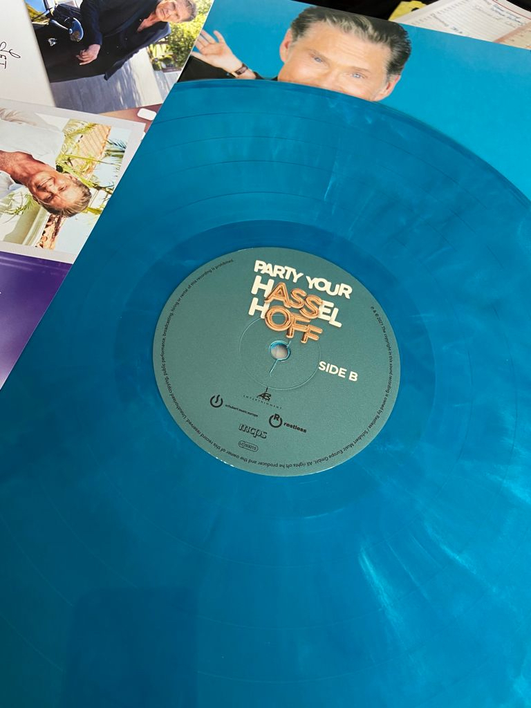 DavidHasselhoff's tweet photo. It's release week for "Party Your Hasselhoff!". The album drops on Friday, featuring some of my favorite songs, recorded in finest Hoff party style.  There will be a limited Pool-Blue-Vinyl-Edition.  Only 1000 copies!  https://t.co/ySRZBFkAfr  @_schubertmusic_   @orchtweets https://t.co/ybOrOEom8O