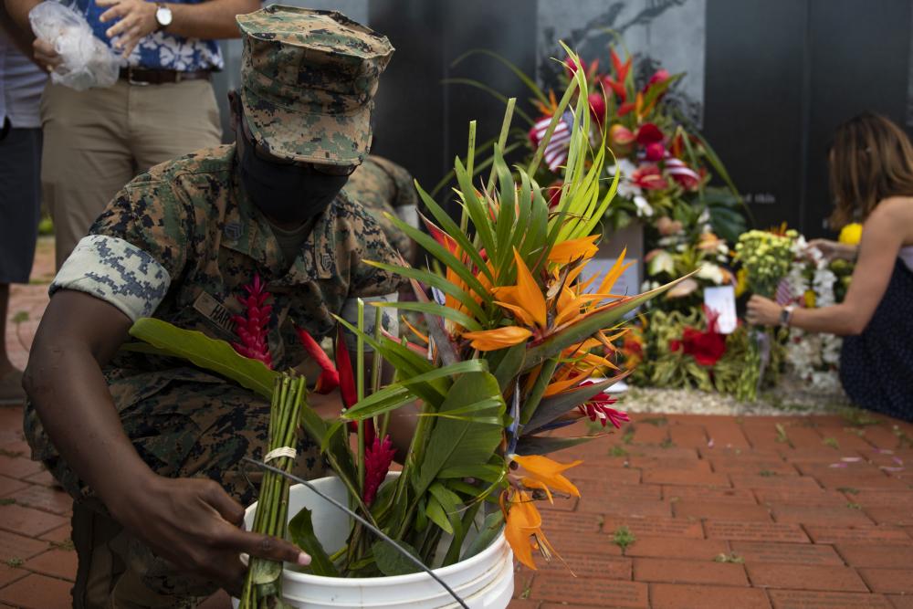 INDOPACOM's tweet image. In support of the 13 service members who lost their lives in Afghanistan, members of the Hawaii community brought flowers to be placed at the Pacific War Memorial for a small, private ceremony. #FallenButNotForgotten