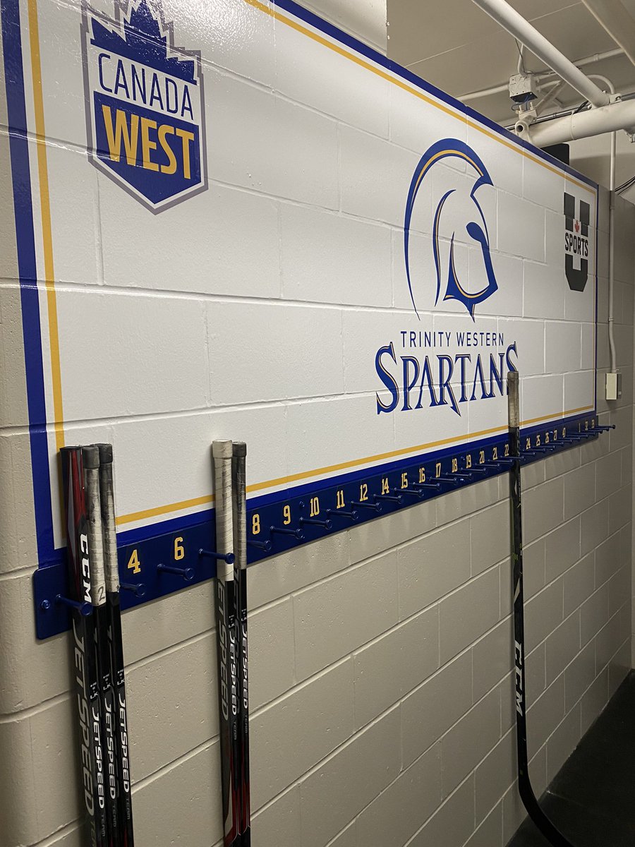 TWUSpartansWHKY's tweet photo. Check out our new custom made stick rack designed and built by our team partner @ClearbrookIron Thanks to Paul and the rest of the staff for this great new addition to our locker room. #twuwomenshockey #programofexcellence @TWUSpartans @CanadaWest @USPORTS_Hockey https://t.co/Txlu9UuOc3
