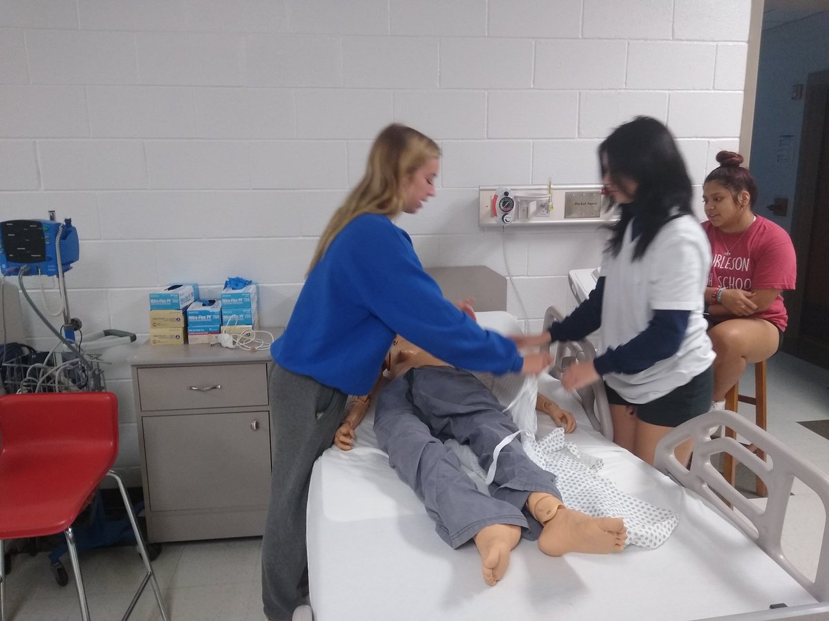 Skills day for Practicum in Health Science. Patient dressing and undressing and linen changing with an occupied bed. <a href="/burleson_cte/">Burleson ISD CTE</a>