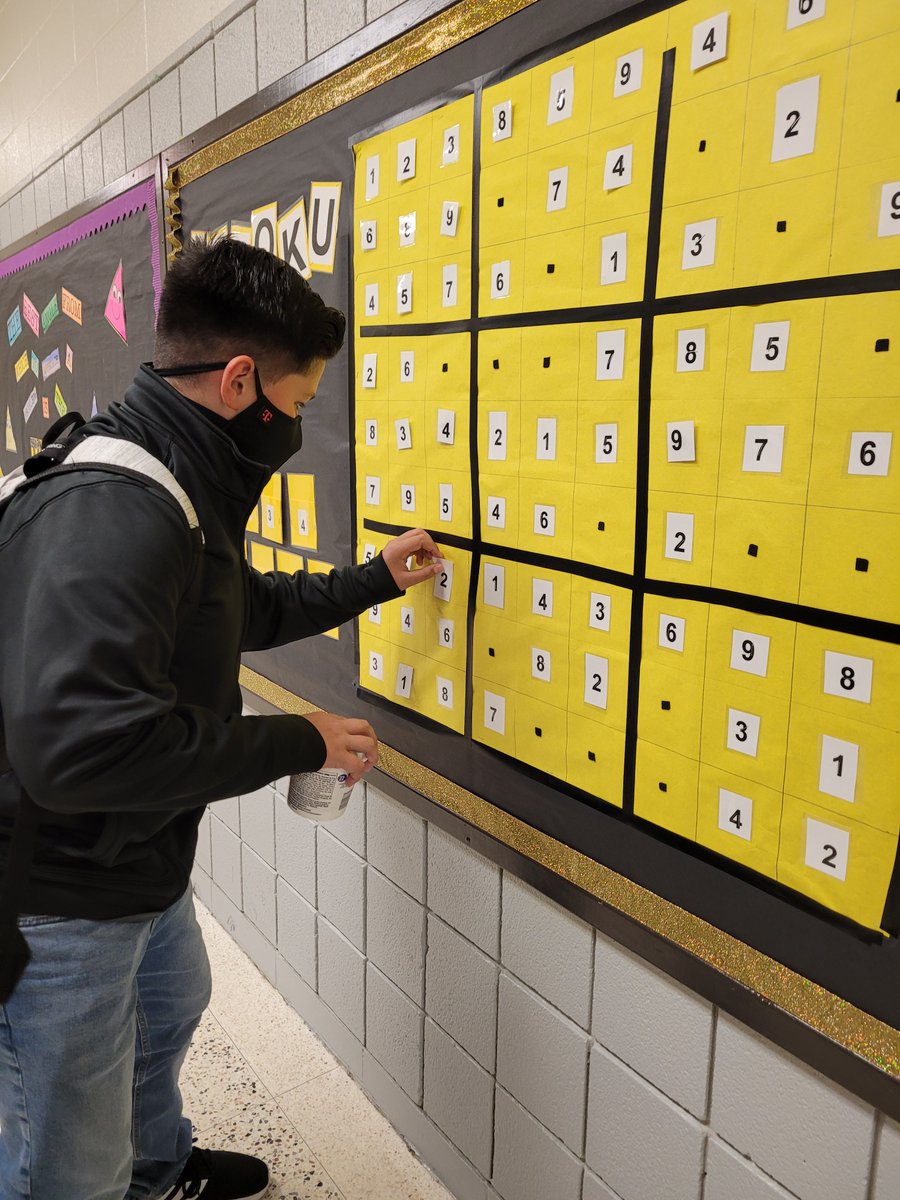 hdperez5's tweet photo. There's always something amazing going on at Travis MS.  Check out our students working on a Sudoku Bulletin Board puzzle.  Great work by our Math teachers in taking student learning outside of the classroom! #problemsolving #TravisGrit #Math #highorderthinking @TerriersTravis https://t.co/9G61IHLXgy
