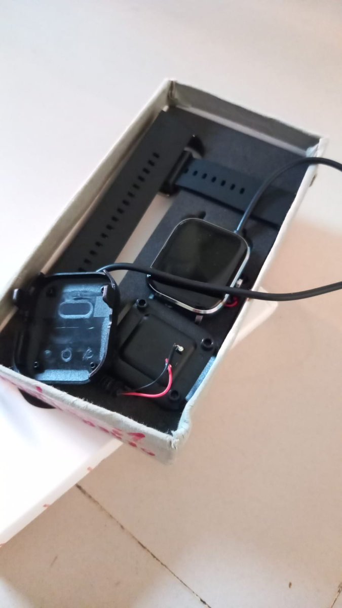 rajibaksha's tweet photo. @shopevolves first u sold fake ip68 watch vikfit hello- that could not even stand sweat and damage. Had 2 send it to u by paying 200. u charged 1500. now u send me another watch with damaged charger and the display is defective. stop cheating https://t.co/09RJJa2oOV