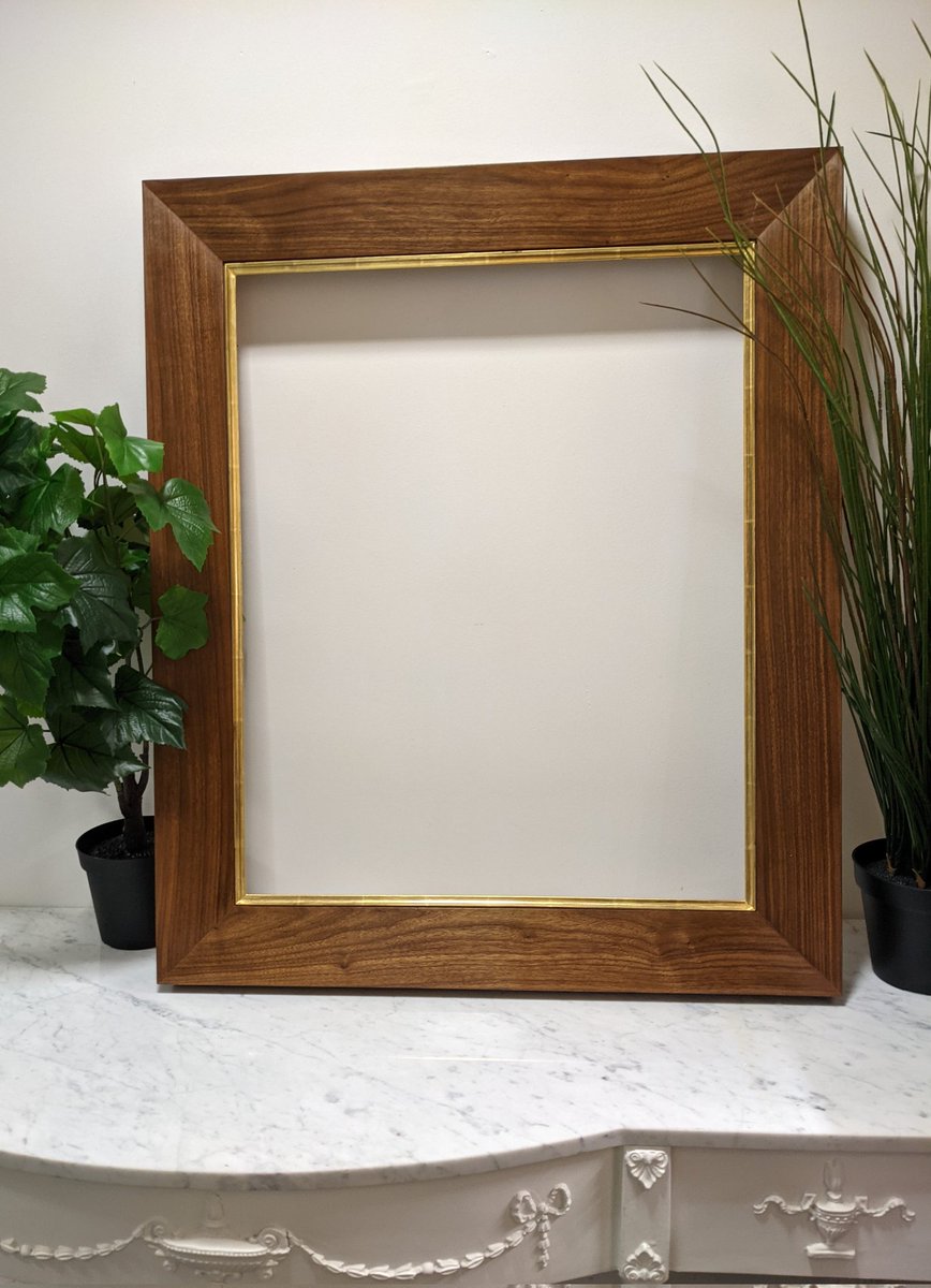A walnut veneer frame with a 22 carat gilded slip for an artist member of the royal society of portrait painters.