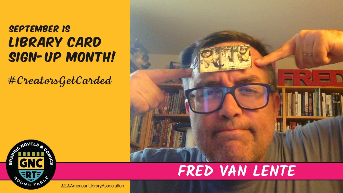 Fred Van Lente pointing with both hands to his library card stuck to his forehead.