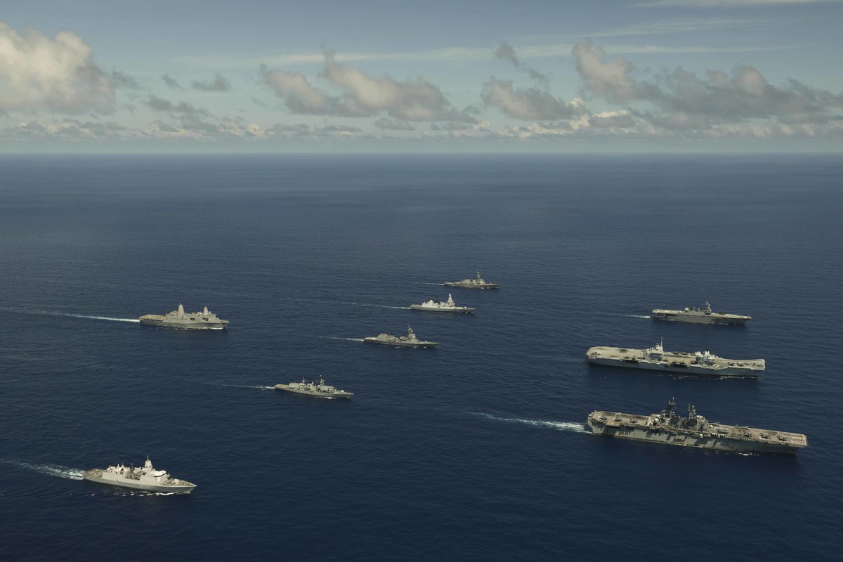 DeptofWar's tweet photo. #ICYMI: The United Kingdom Carrier Strike Group and #USSAmerica Expeditionary Strike Group joined together for #LSGE21. During the exercise, they've been conducting advanced operations that support a #FreeAndOpenIndoPacific. https://t.co/UVzyFONjjB