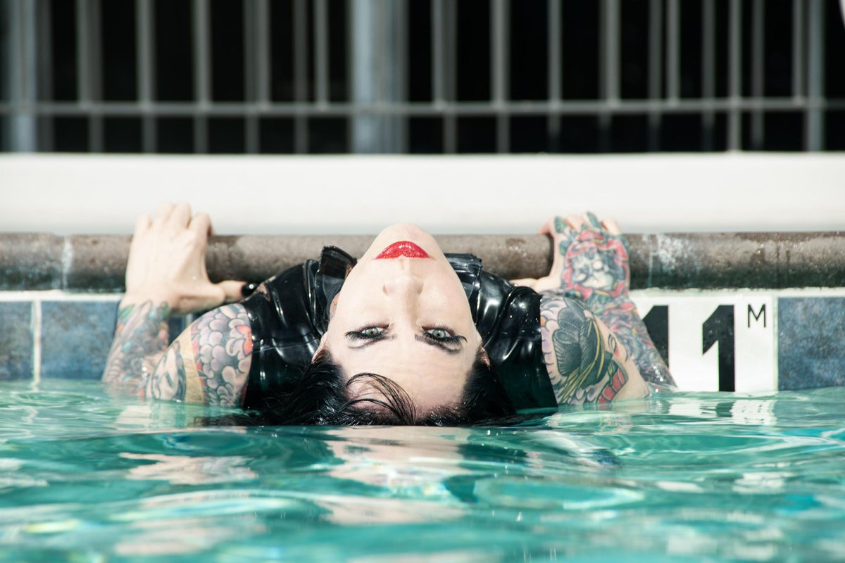 Another AMAZING photo from our @DomConLA latex pool shoot 💦🖤 photo @ProPhotoInLA
