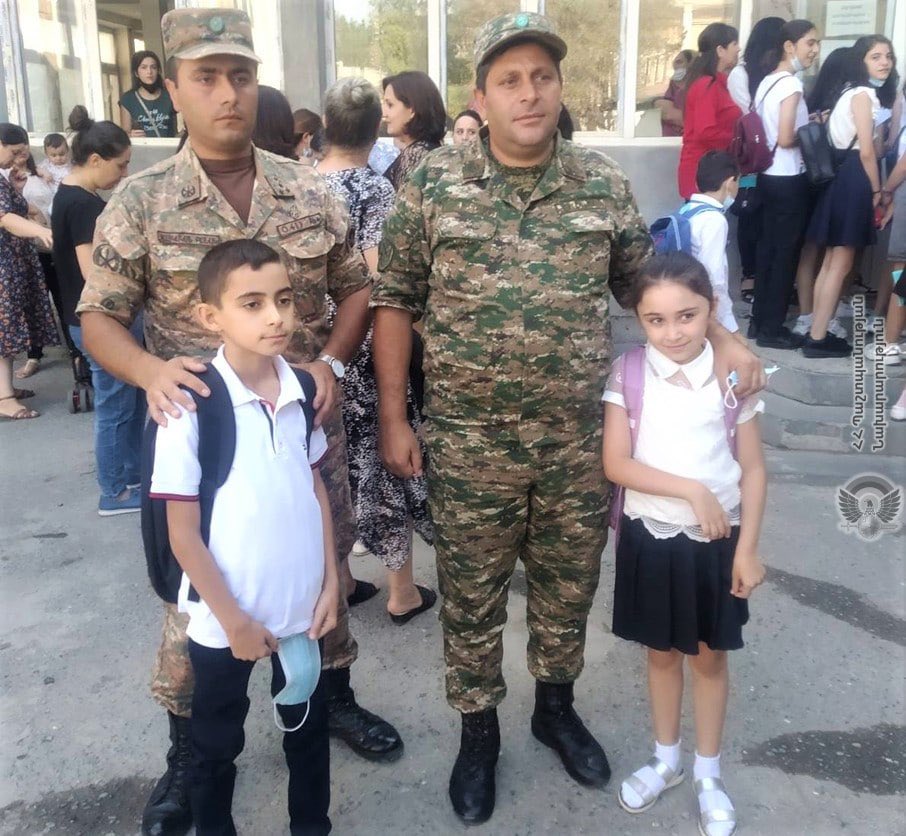 301arm's tweet photo. Artsakh: soldiers accompany children of their fellow martyrs to school. https://t.co/HehXzDYRUM