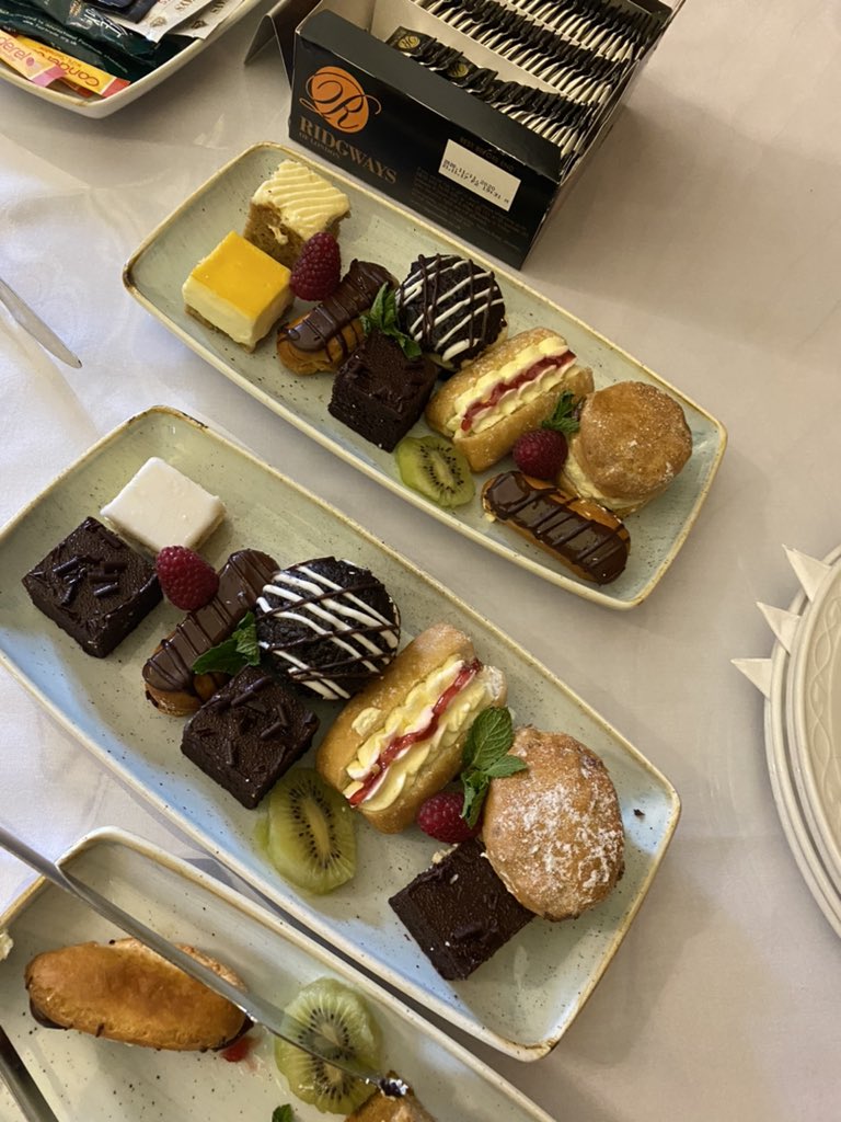kirstyvale's tweet photo. Wonderful to meet and welcome @WaddingtonPost to @KeeleUniversity yesterday, for a mini tour of the campus and plentiful introductions, naturally ending at #KeeleHall with this sublime selection of cakes 🍰 https://t.co/fJDTHSs2ci