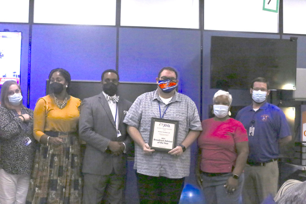 nationalJEA's tweet photo. JEA South Carolina state director Leslie Dennis surprised Andrew Chambers, CJE, with the 2021 Broadcast Adviser of the Year award at Richland Northeast HS this morning. Photos by @RNECavaliers senior Lillian Altschul.
Read about his award: https://t.co/IPrryEqc45

@ajchambers https://t.co/7arRb4YBIq