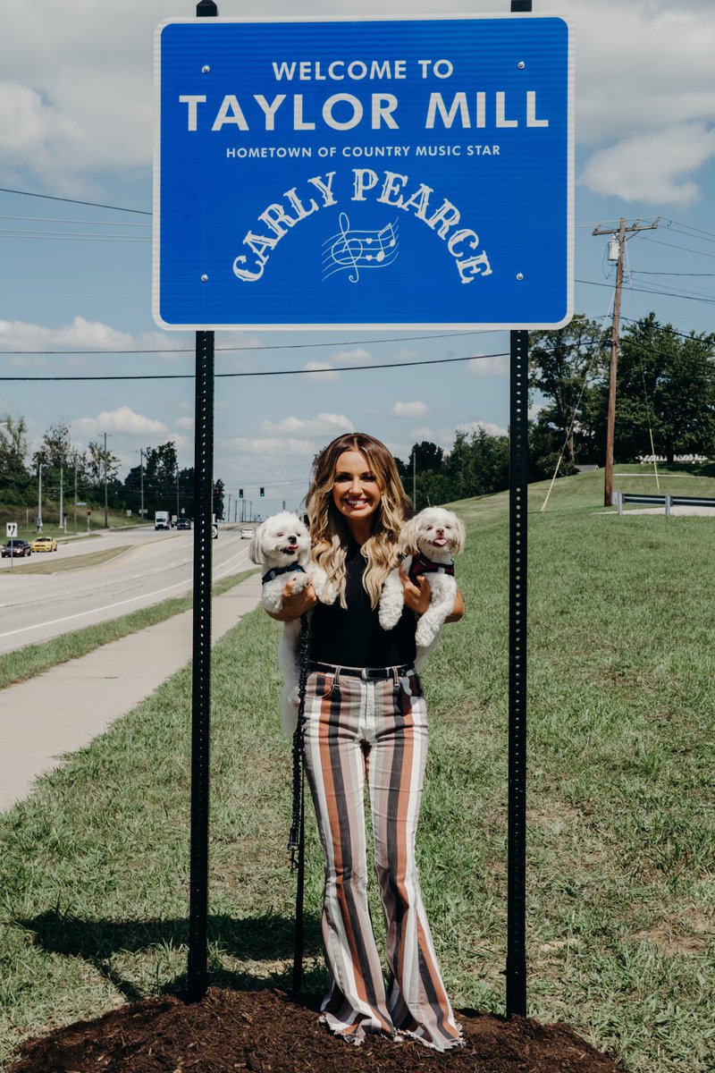 carlypearce's tweet photo. I convinced my parents at 16 to drop out of high school &amp; leave my hometown. Today, that same home town honored me with “Carly Pearce Day” and 2 of these signs at both ends of the town. I truly have no words. This town made me who I am…. I will always 🤍 you, Taylor Mill. https://t.co/0sxqc2mOgt