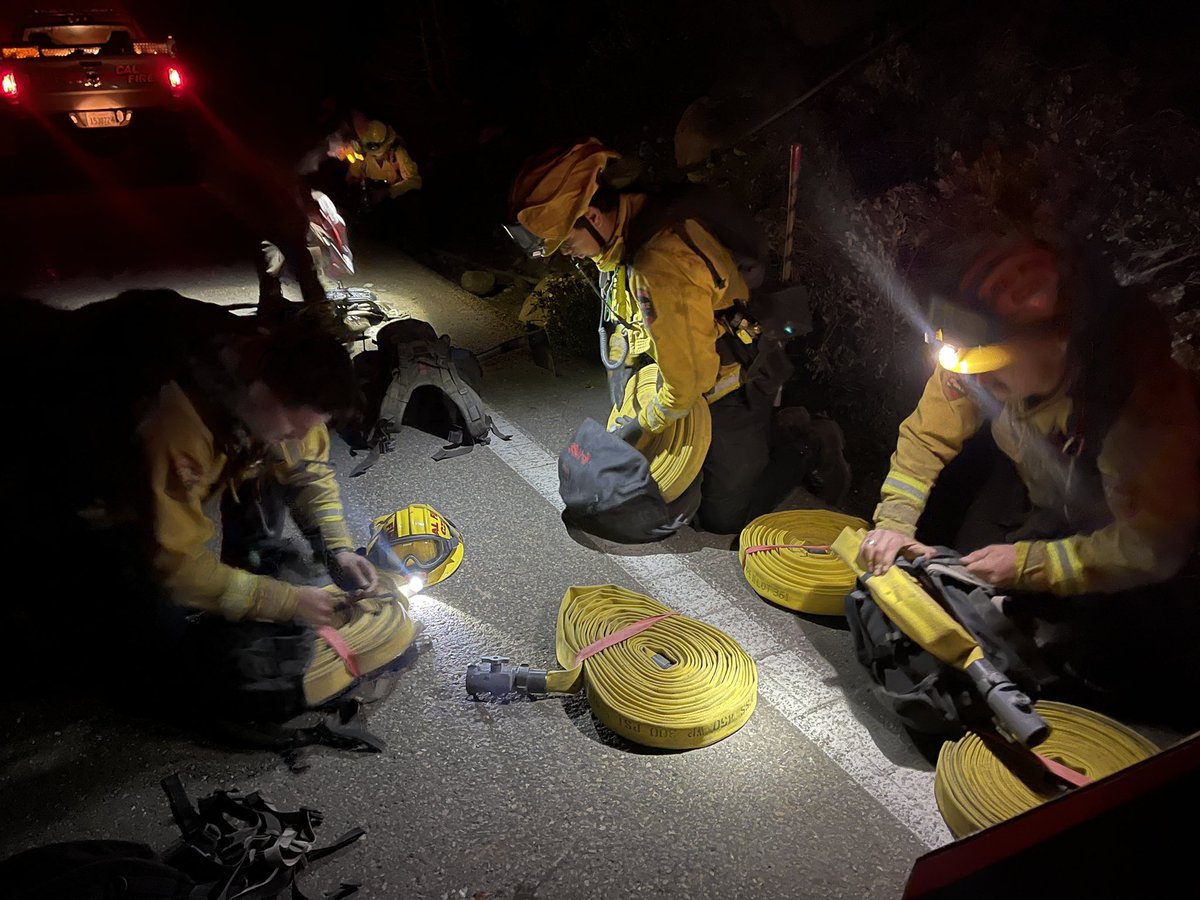 USFS and cal fire firefighters prepare hose to haul up 1200 vertical ft of steep fireline to extend a 6,000 ft hoselay above kirkwood last night. Hiking in the fire, in the middle of the night, at 7500 feet with 60 lbs or more on their backs. They deserve our thanks. #caldorfire