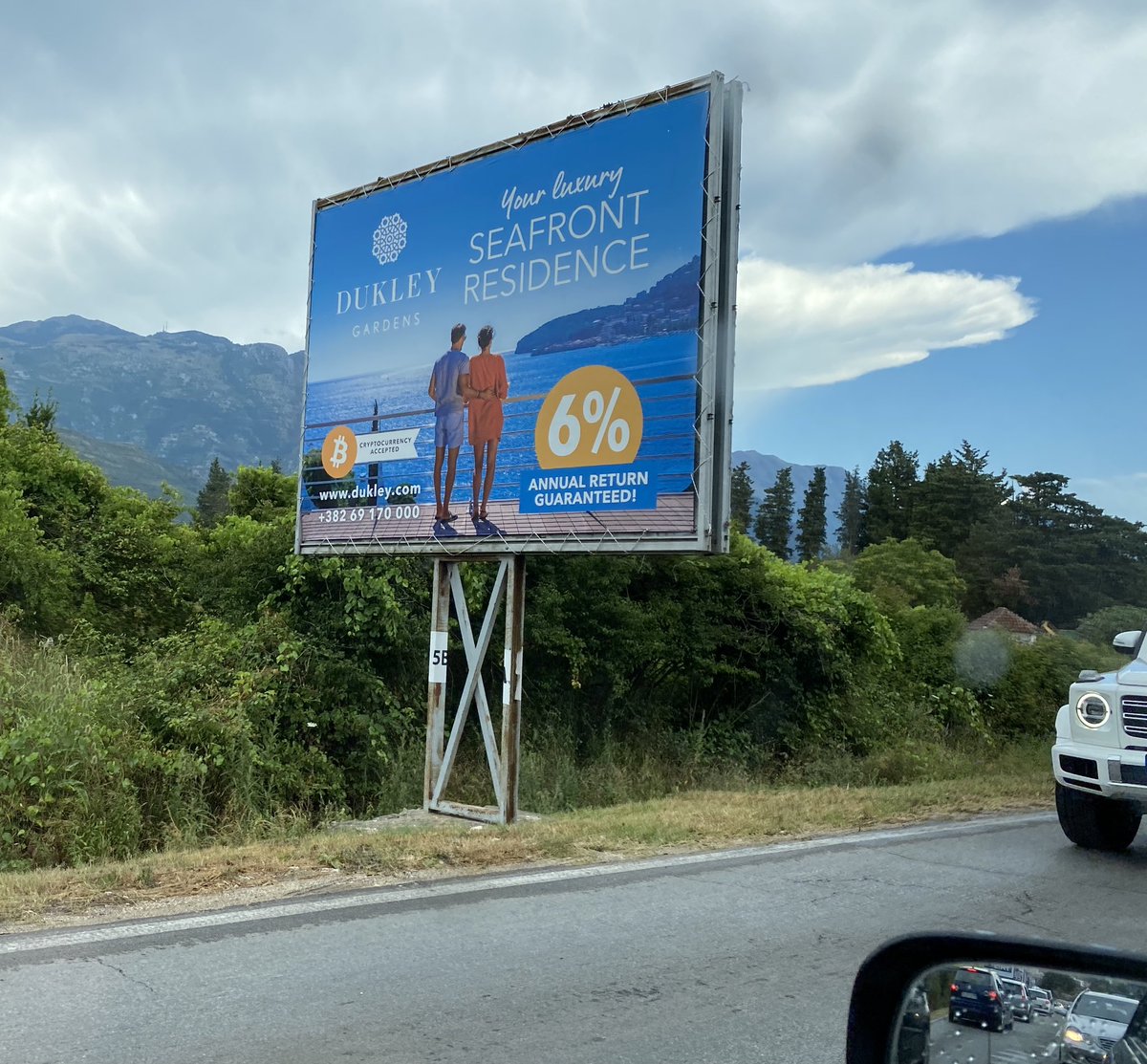 Patrick__McG's tweet photo. @bitcoinarchive Drove by this, advertisement for a new real estate development in Montenegro with 6% guaranteed returns……you might do a bit better than 6% if you just #HODL #Bitcoin https://t.co/8w0PdoYvyL