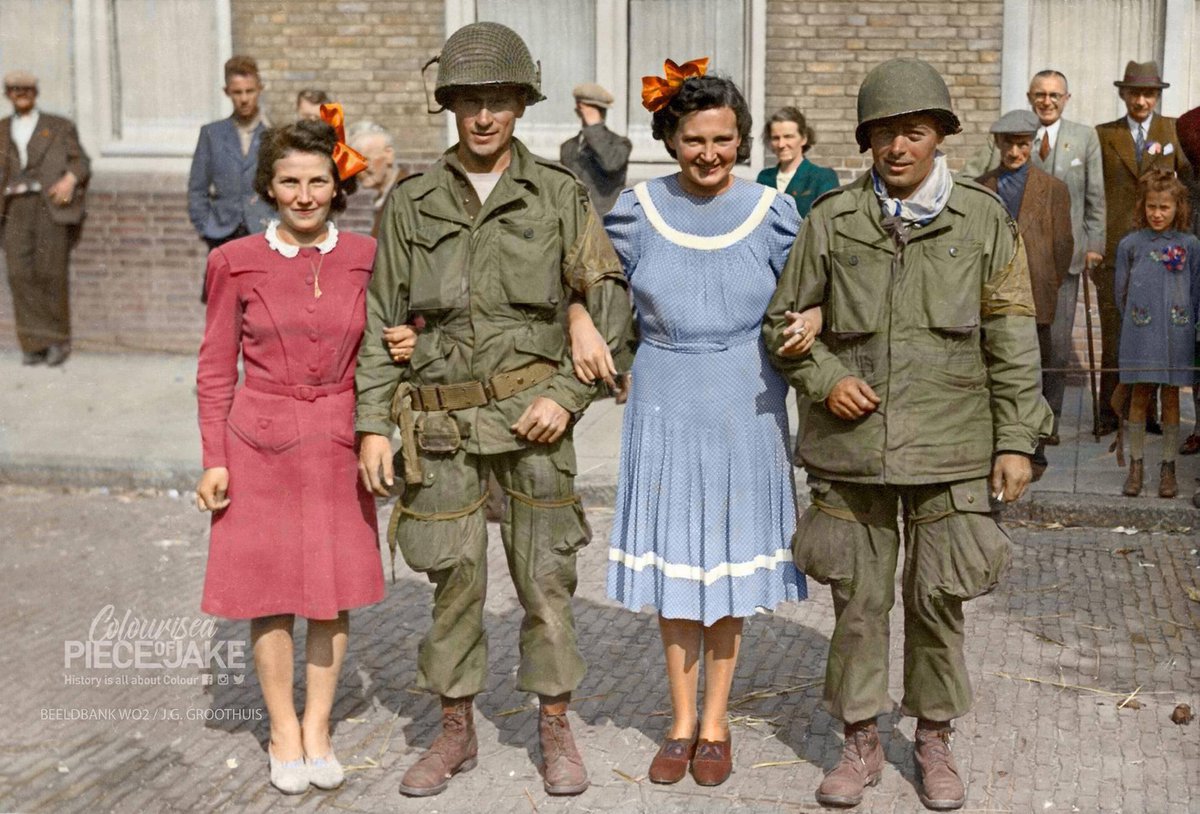 Locals from #Eindhoven have a picture taken with their #liberators. The #US #101stAirborne Div. #506thPIR. 9/18/1944,
Both were dropped in #Son #NoordBrabant on 17-9-1944.

L to R:
Unknown/ Harry Buxton, #KIA at Veghel 27-9, Fransisca M. Janssen, Bladel 
Sgt. Norman A. Capels
