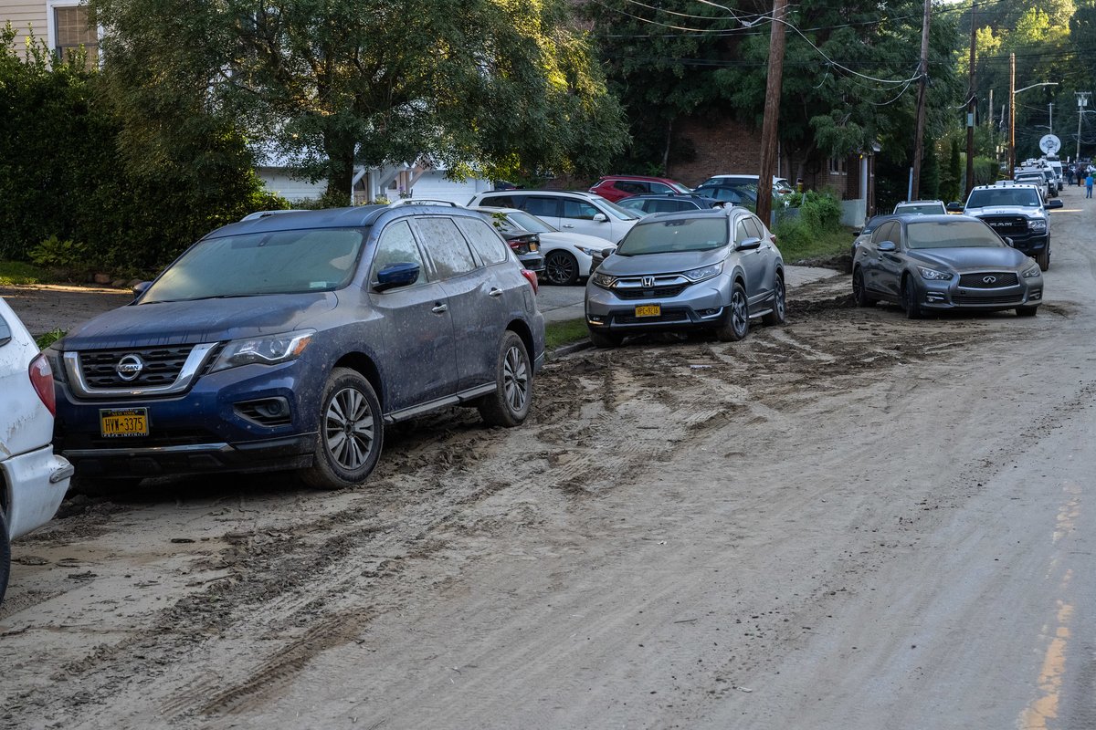 A Yonkers road that was entirely flooded following Tropical Depression Ida, leaving mud, debris and immobilized cars behind. 