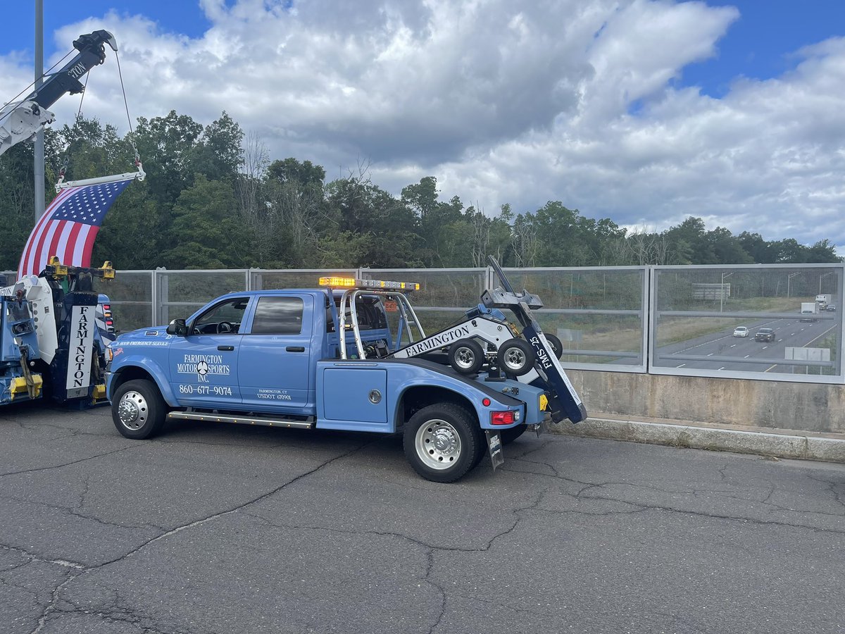 Right now: Farmington Motor Sports Towing and Recovery raise an American flag to honor State Police Sergeant Brian Mohl as he is transported to the funeral home. Sergeant Mohl tragically lost his life Thursday when he was swept away in floodwaters in Woodbury.
