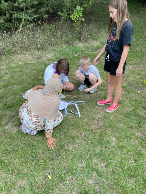MsYesnes's tweet photo. What a fun challenge: who can make the longest strand?? Materials: rubber bands, paper, string, and labels all inside an envelope! Amazing collaboration, creativity, out of the box thinking, and team work! #ASMultiagefamily https://t.co/EOF3VsvRa6