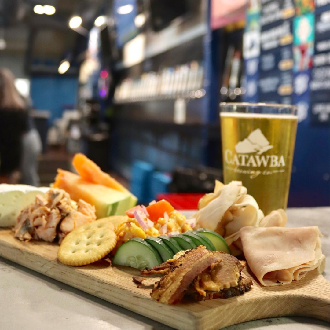 CatawbaBeer's tweet photo. SURPRISE! Our Charlotte Tasting Room has a new kitchen!! Swing by sometime this holiday weekend to check it out. What can you expect? Four words: White Zombie Beer Cheese. That's right the menu features dishes incorporating your favorite Catawba beers. https://t.co/km701bNMOZ