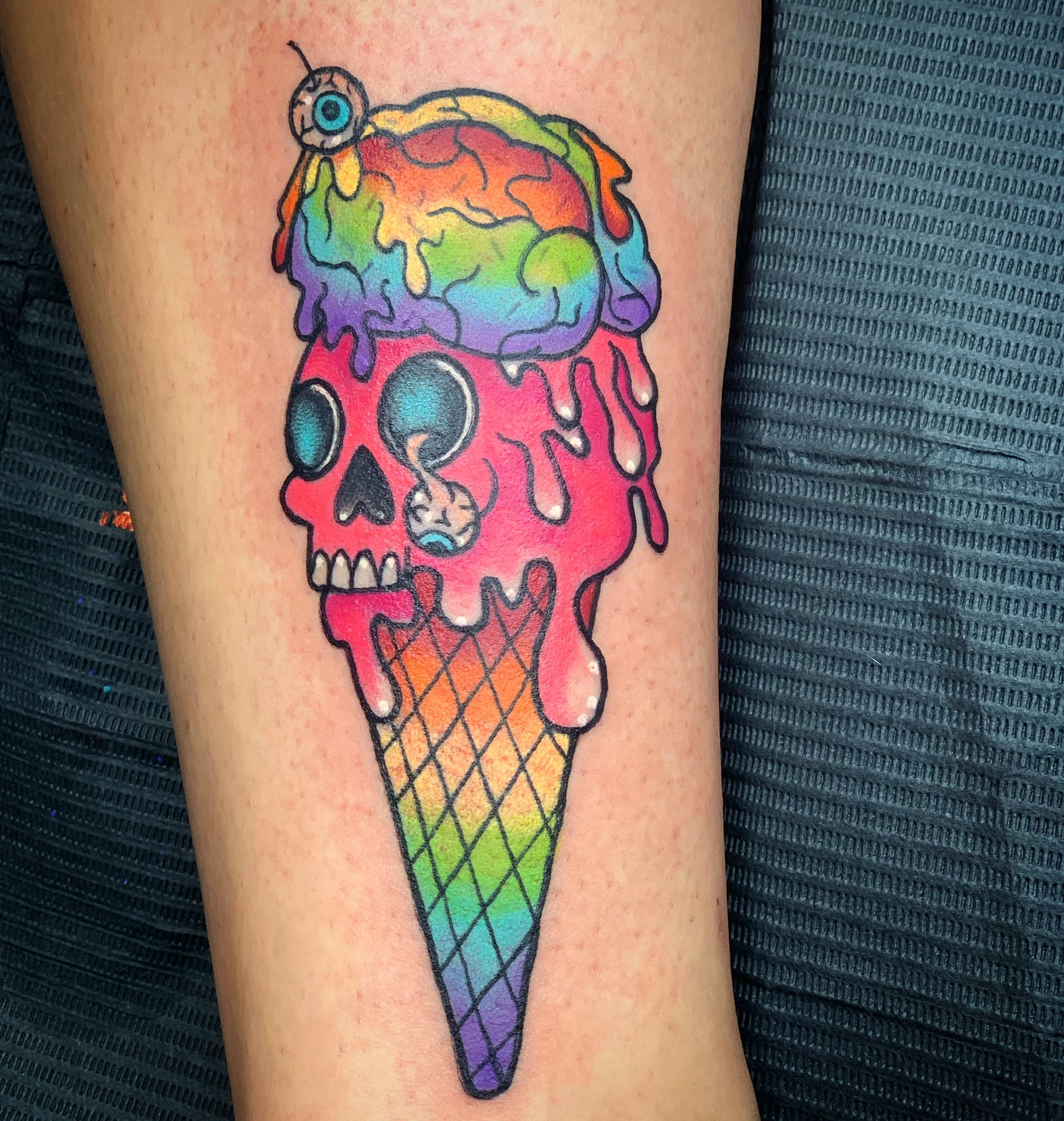 Delicious ice cream cone tattoo on the sternum - Tattoogrid.net