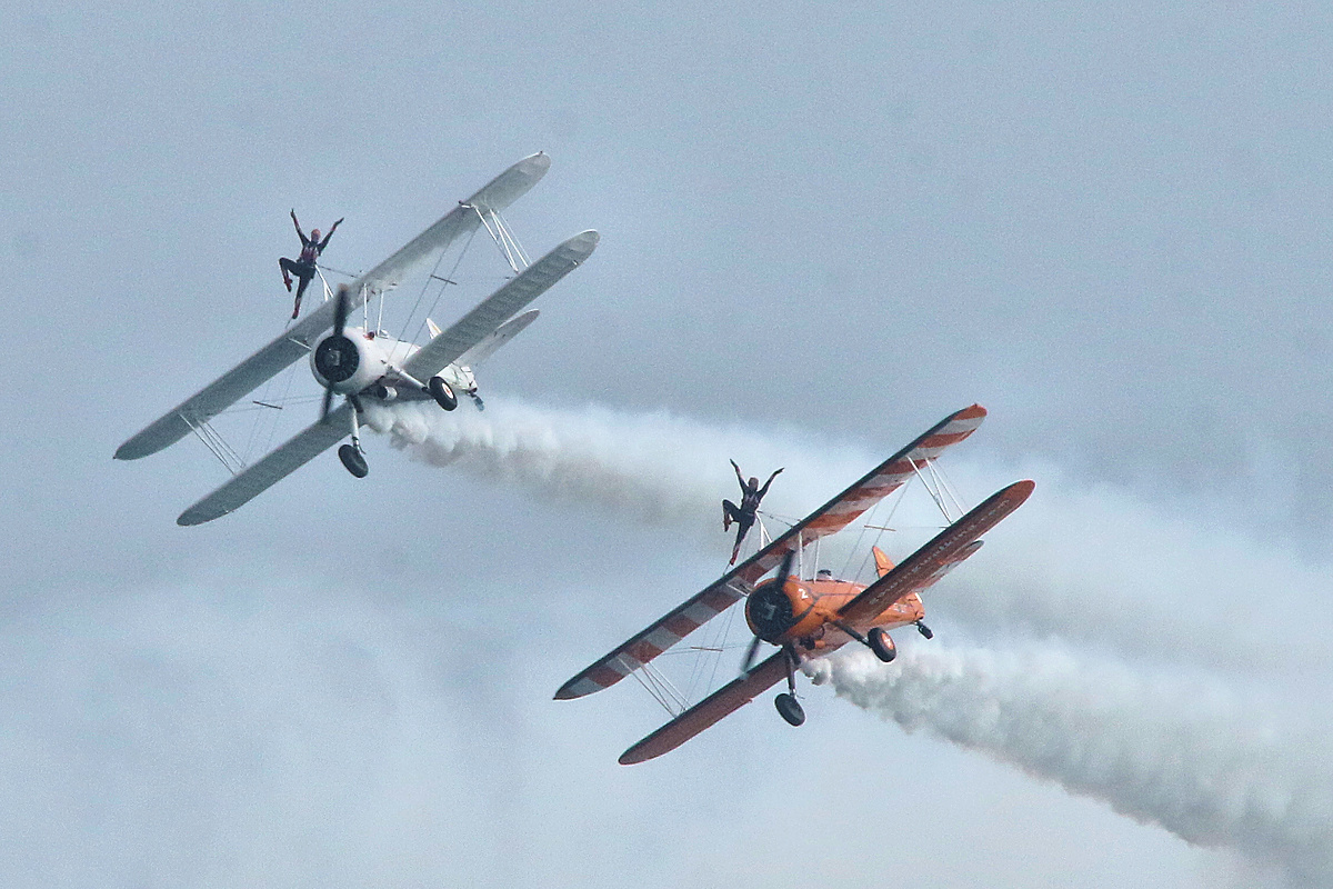 petermilford's tweet photo. The wing walkers display at Bournemouth today (4th September) just before the incident in which the white Stearman ditched into the sea near Sandbanks. Thankfully both pilot and wing walker are safe. #bournemouthairfestival https://t.co/PHd20UjbRg